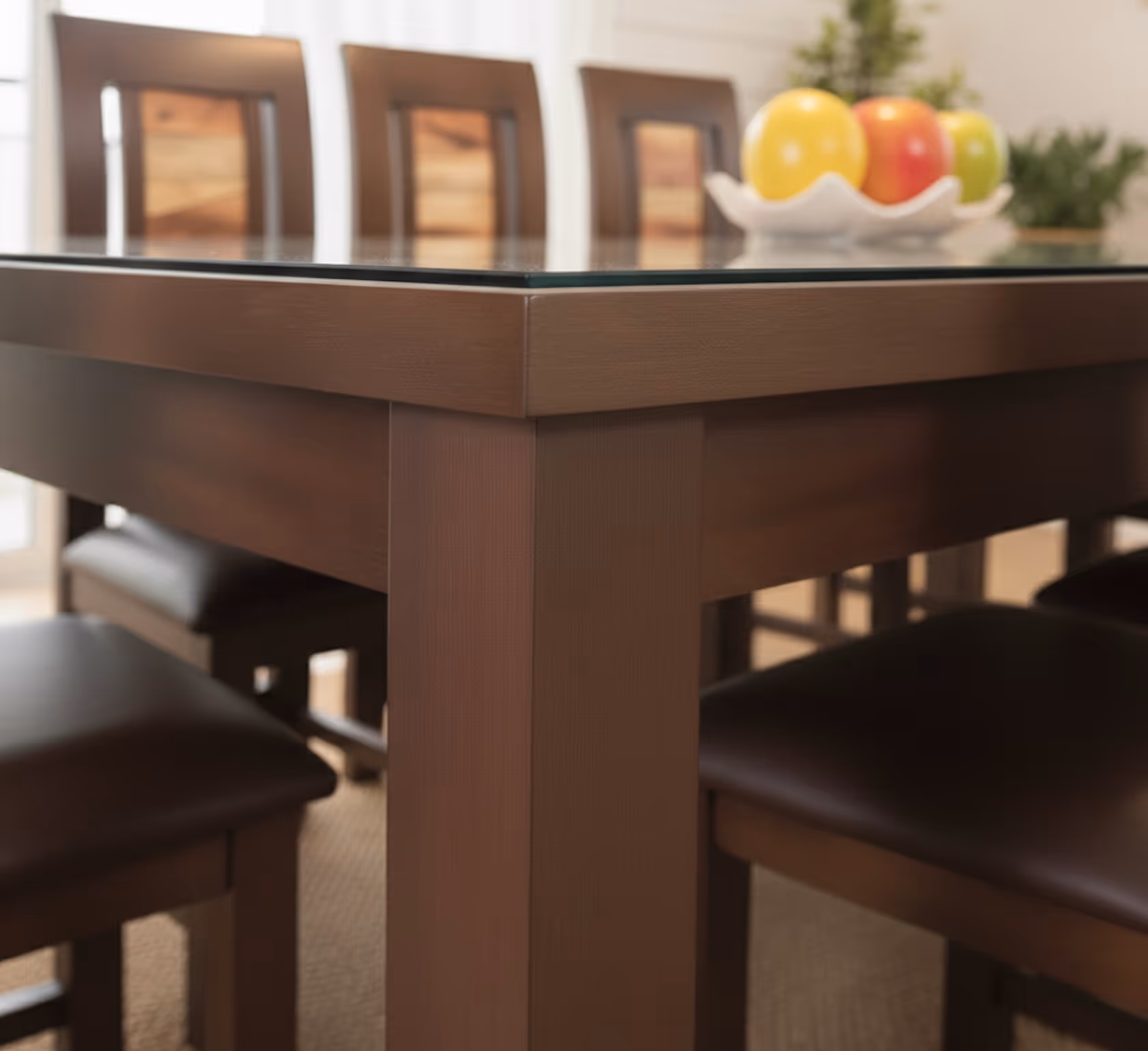 Close-up of the Aurora table corner, glass top over a dark wood frame