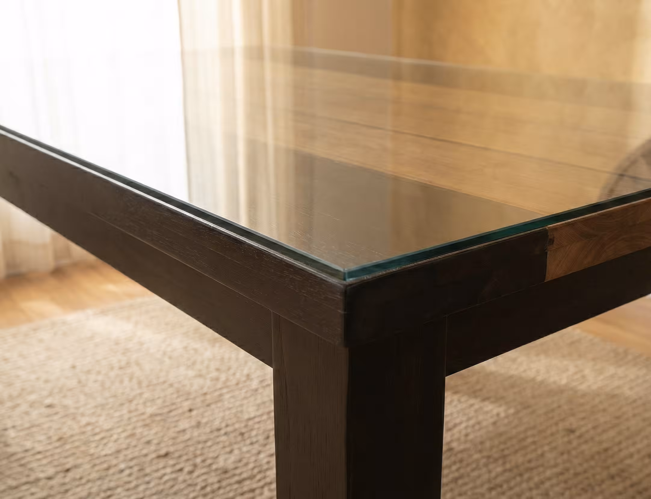 Close-up of the Bellagio glass top on its dark wood frame