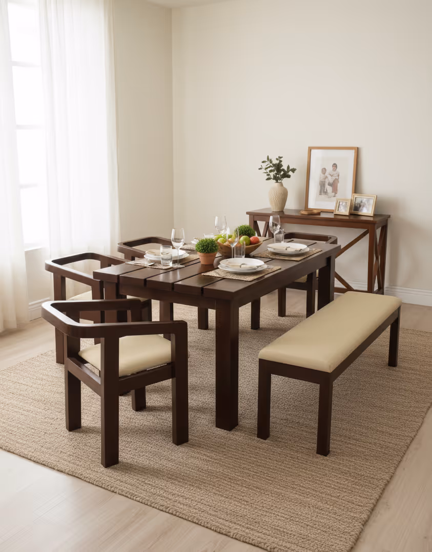 Sorrento dining set: dark table with sculpted armchairs and a bench, cream upholstered seats