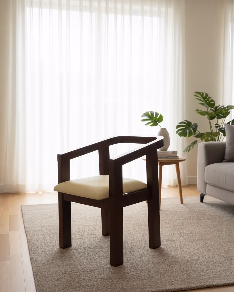 Dark-finished wooden armchair with a cream upholstered seat