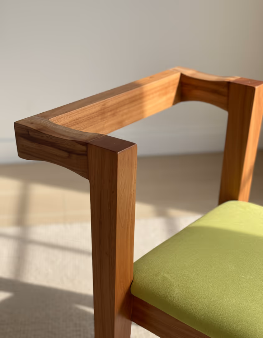 Close-up of a chair arm joint in pale wood